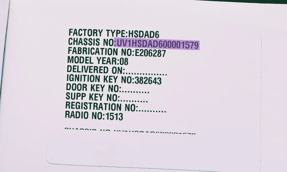 Dacia Logan registration certificate and vehicle logbook highlighting the 17-digit VIN number